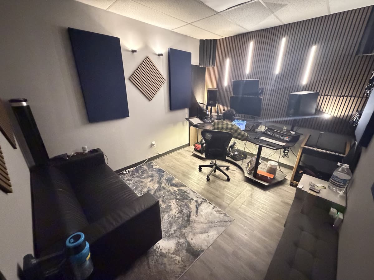 The AMPED UP AUDIO control room with the lights up